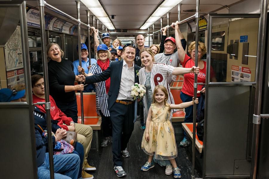 A wedding party on the Philadelphia subway on the way to a Phillies game reception.